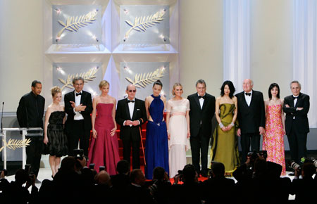 Jury president Stephen Frears (8th L) stands on stage with (from L to R) Abderrahmane Sissako, Sarah Polley, Orhan Pamuk, Toni Collette, Manoel de Oliveira, Shu Qi, Master of Ceremonies Diane Kruger, Maggie Cheung, Michel Piccoli, Maria De Medeiros and Marco Bellocchio during the opening ceremony of the 60th Cannes Film Festival May 16, 2007.